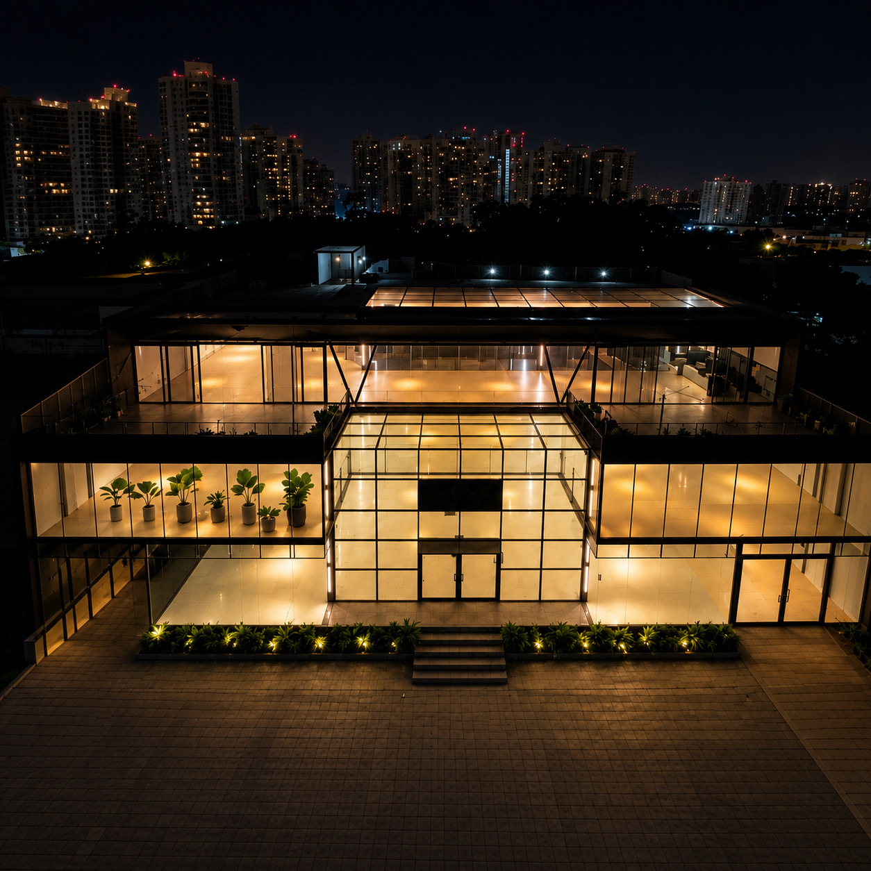 Concessionária em reforma — fachada noturna, Vila Olímpia